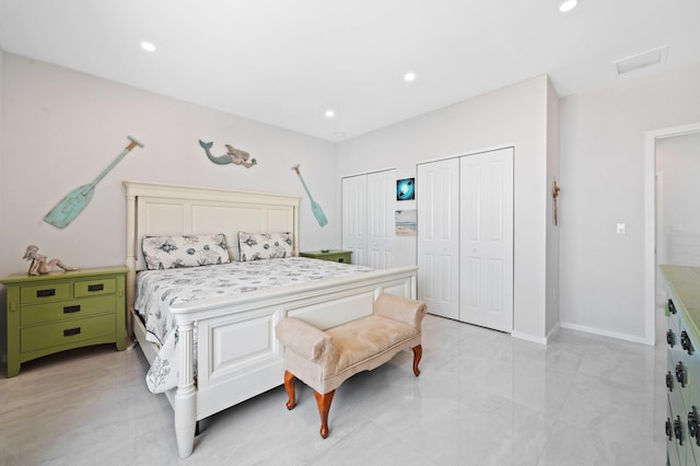 94825 Overseas Hwy Unit 185, Key Largo, FL 33037 - bedroom with two closets, recessed lighting, and light marble finish flooring