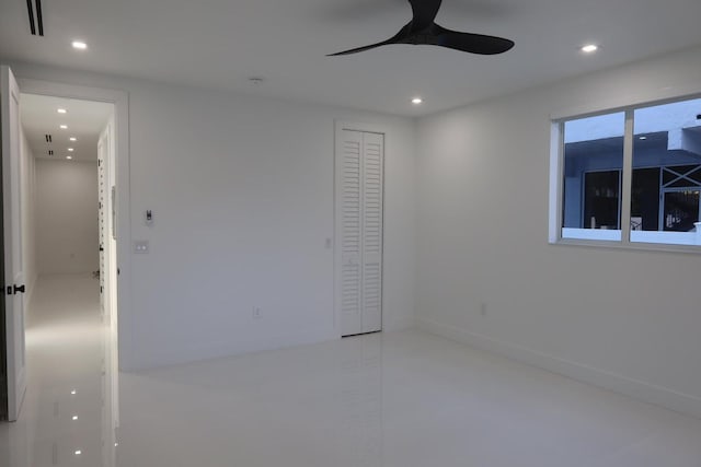 spare room featuring ceiling fan