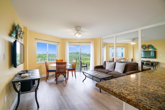 interior space with ceiling fan and hardwood / wood-style floors