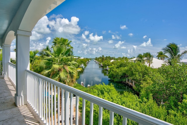 balcony featuring a water view