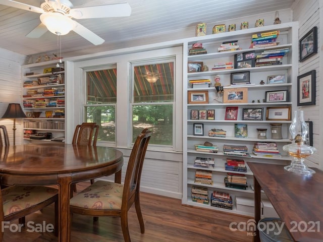 dining room featuring ceiling fan and dark hardwood / wood-style flooring