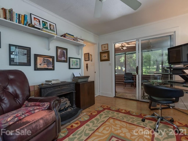 office with ceiling fan, hardwood / wood-style flooring, and crown molding