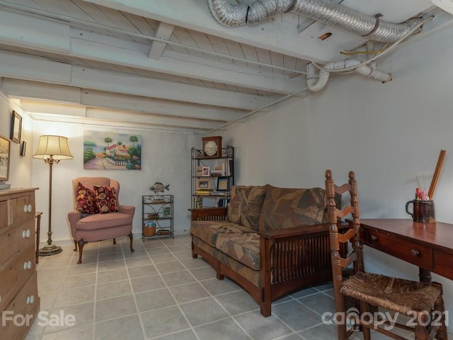 living room with light tile flooring and beamed ceiling