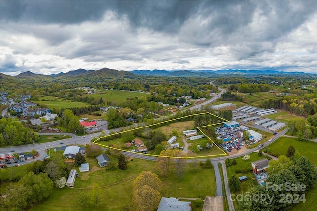 birds eye view of property featuring a mountain view