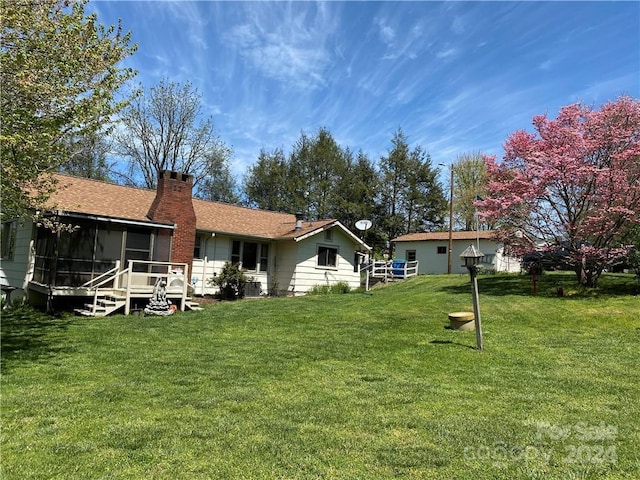 view of yard featuring a sunroom