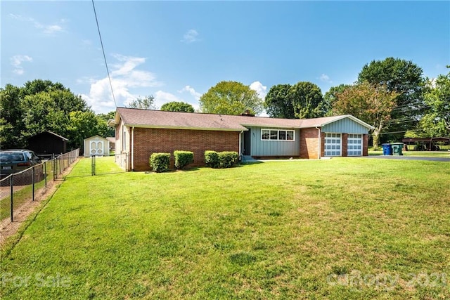 view of front of property with a front yard and an outdoor structure