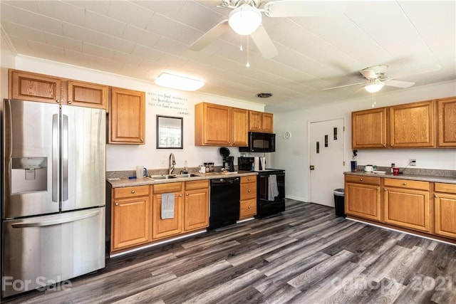 kitchen featuring ceiling fan, dark hardwood / wood-style flooring, black appliances, and sink