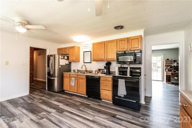 kitchen featuring ceiling fan, dark wood-type flooring, black appliances, and sink