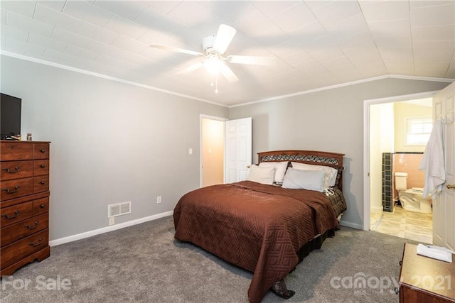 carpeted bedroom featuring ceiling fan, lofted ceiling, ornamental molding, and ensuite bathroom