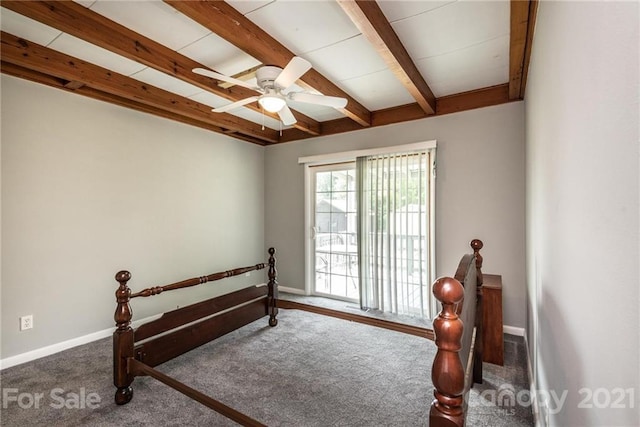 bedroom with dark carpet, ceiling fan, and beamed ceiling