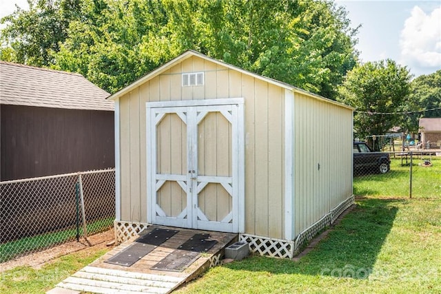 view of shed / structure with a lawn