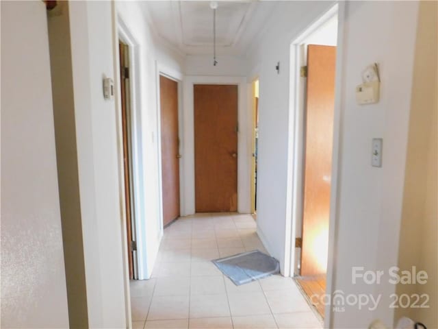 hallway featuring light tile flooring