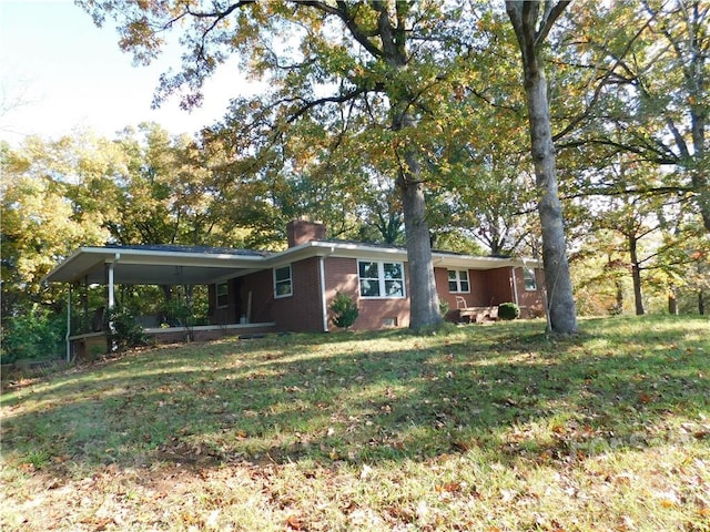 rear view of house with a lawn