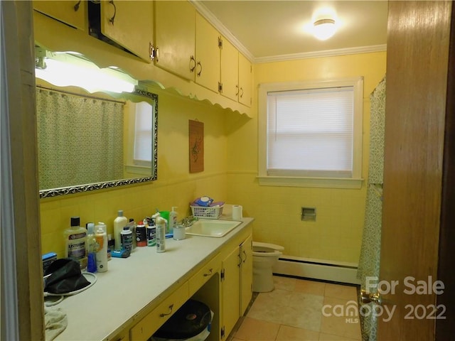 bathroom with vanity, tile walls, tile floors, a baseboard radiator, and toilet