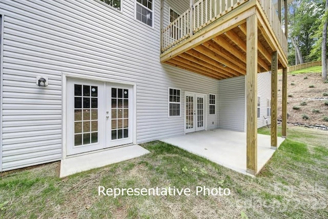 view of patio / terrace featuring a balcony and french doors