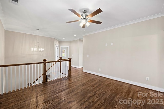 unfurnished room with crown molding, dark hardwood / wood-style floors, and ceiling fan with notable chandelier