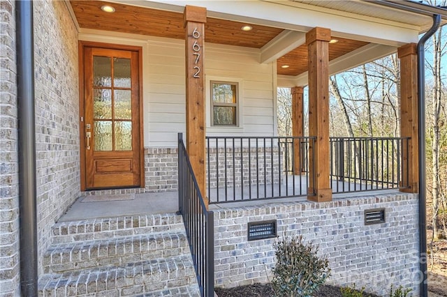 property entrance with covered porch