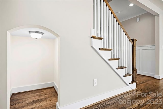 stairs featuring dark hardwood / wood-style floors