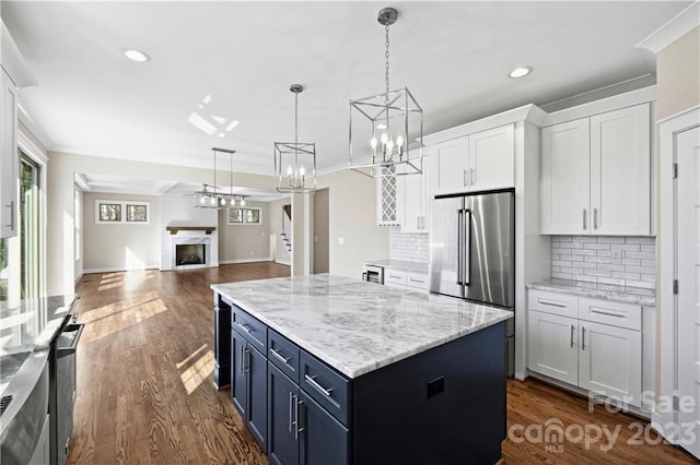 kitchen featuring white cabinets, backsplash, and dark hardwood / wood-style flooring