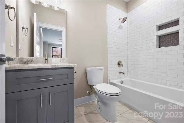 full bathroom featuring tile floors, toilet, vanity, and tiled shower / bath