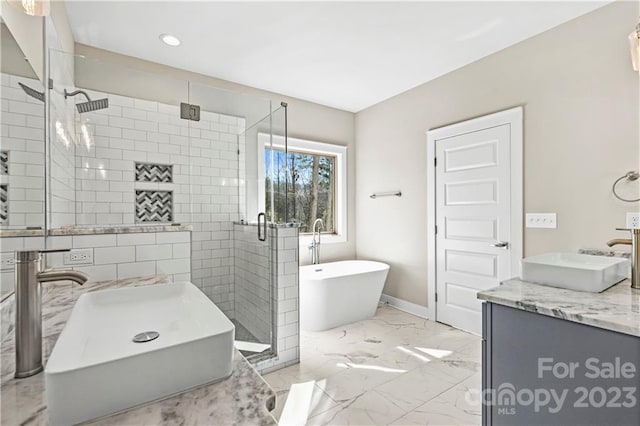 bathroom featuring shower with separate bathtub, dual sinks, tile floors, and vanity with extensive cabinet space