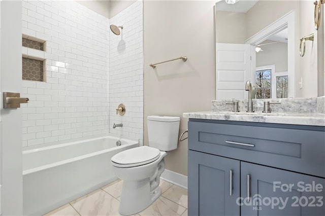 full bathroom featuring toilet, tile floors, tiled shower / bath combo, and vanity