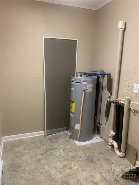 utility room featuring electric water heater