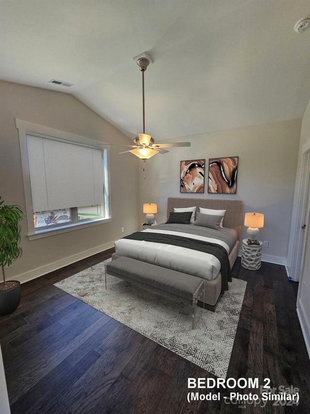 bedroom with ceiling fan, vaulted ceiling, and dark hardwood / wood-style floors