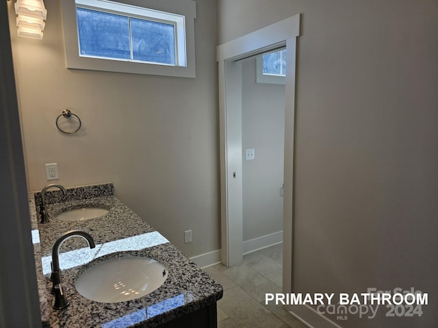 bathroom featuring vanity and plenty of natural light