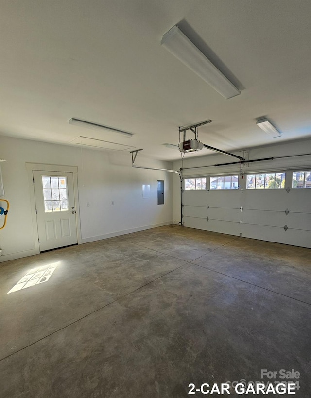 garage with electric panel and a garage door opener