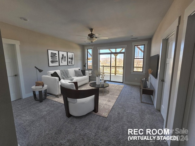 carpeted living room featuring ceiling fan