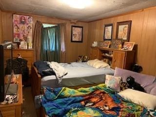 bedroom with wooden walls