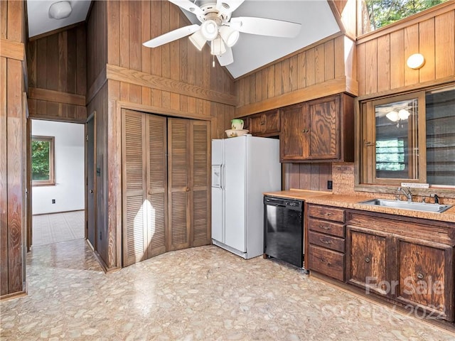 kitchen with white refrigerator with ice dispenser, high vaulted ceiling, black dishwasher, ceiling fan, and light tile flooring