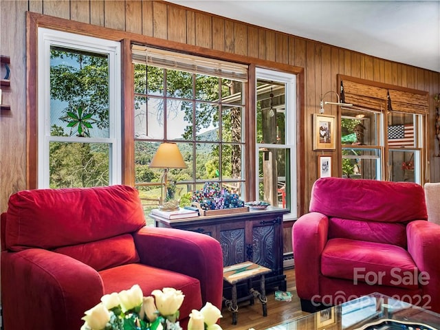 interior space featuring wood walls and hardwood / wood-style flooring