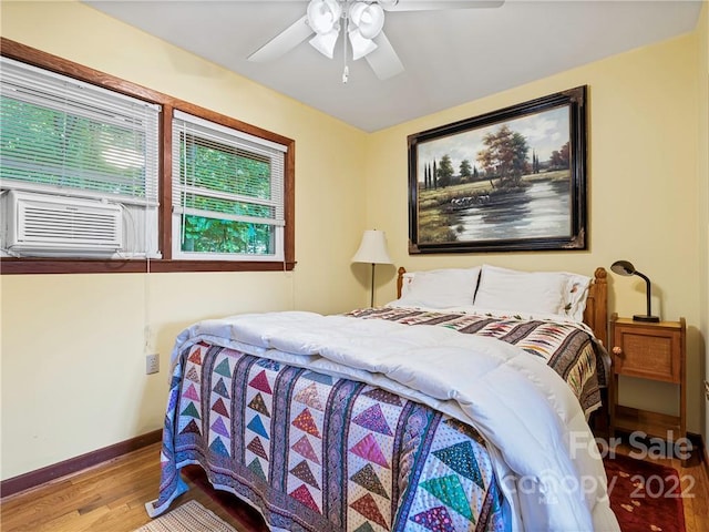 bedroom with wood-type flooring and ceiling fan