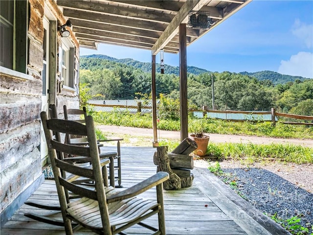 wooden terrace featuring a mountain view