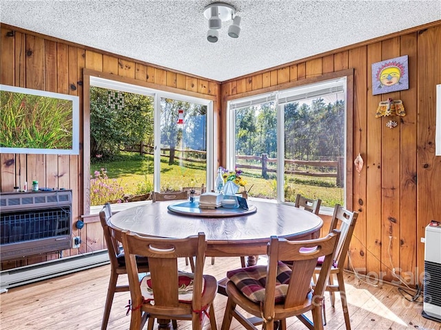 sunroom featuring baseboard heating