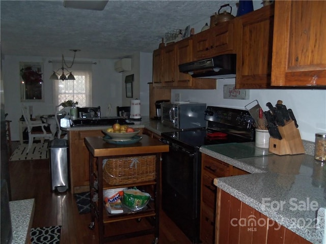 kitchen featuring light stone counters, a wall mounted air conditioner, a textured ceiling, fume extractor, and black electric range