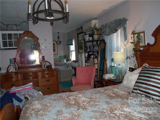 bedroom with a notable chandelier, an AC wall unit, and multiple windows