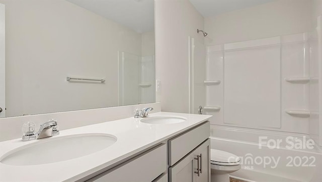 full bathroom with double vanity, toilet, and tub / shower combination