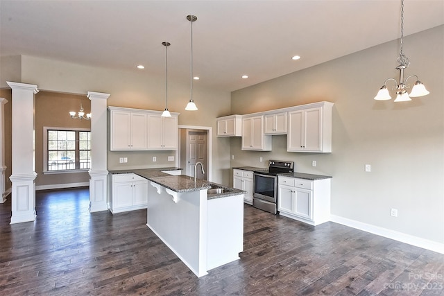 kitchen featuring dark hardwood / wood-style flooring, an inviting chandelier, white cabinetry, electric stove, and pendant lighting