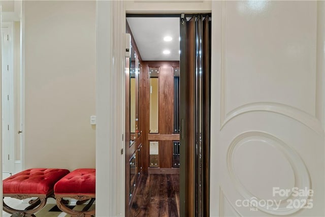 corridor featuring dark hardwood / wood-style floors