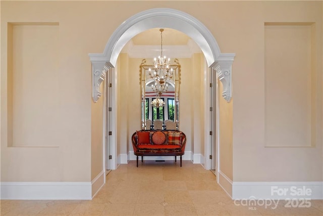 18019 Harbor Light Blvd, Cornelius, NC 28031 - hallway with arched walkways, a chandelier, crown molding, and baseboards
