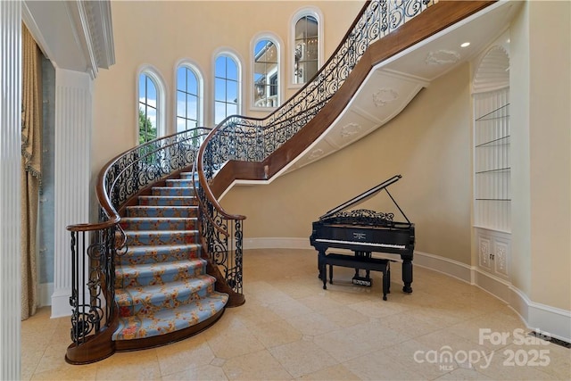 18019 Harbor Light Blvd, Cornelius, NC 28031 - stairway featuring a towering ceiling, baseboards, and tile patterned flooring