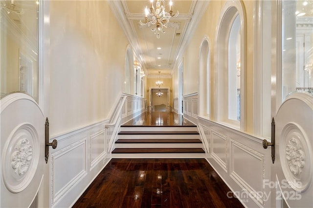 18019 Harbor Light Blvd, Cornelius, NC 28031 - stairs with a chandelier, a decorative wall, hardwood / wood-style flooring, and crown molding