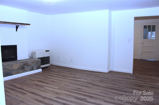 4 Morgan Cove Rd, Candler, NC 28715 - unfurnished living room with baseboards, a fireplace, wood finished floors, and heating unit