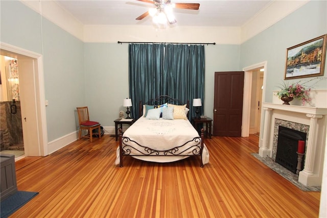 bedroom featuring ceiling fan and hardwood / wood-style floors