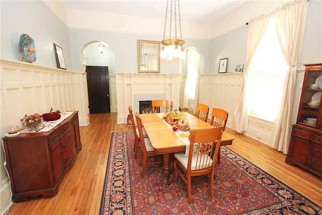 dining room featuring a notable chandelier and light wood-type flooring