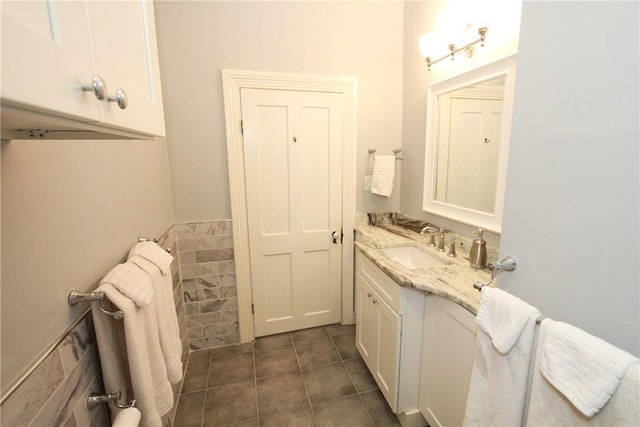 bathroom featuring vanity and tile floors