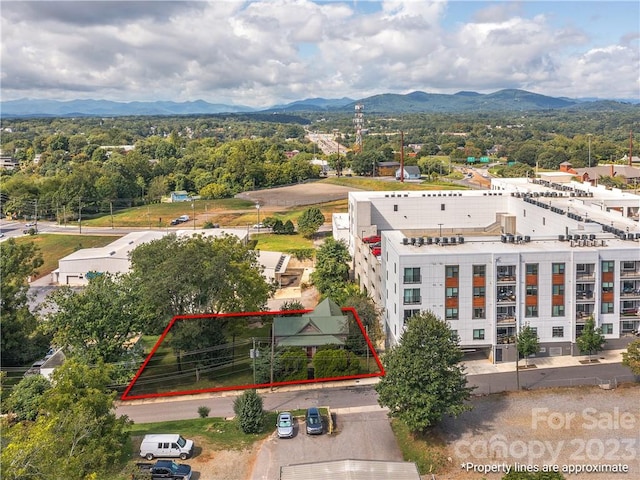 birds eye view of property featuring a mountain view